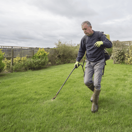 Man applies weed killer to grassy area without knowing the dangers